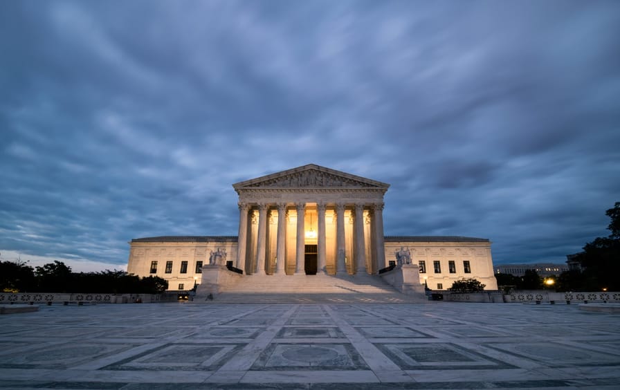 Supreme Court with moody sky
