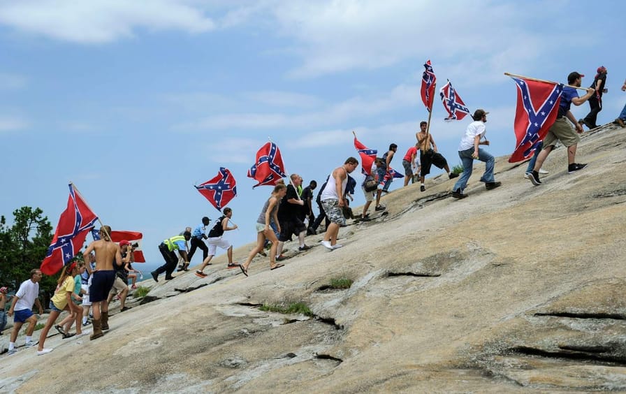 neo-Confederates walk uphill