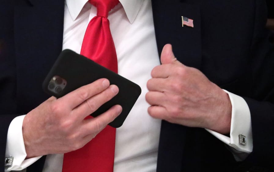 Trump with cell phone