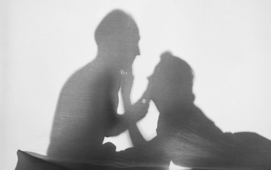 Romantic Couple Silhouetted in a Tent