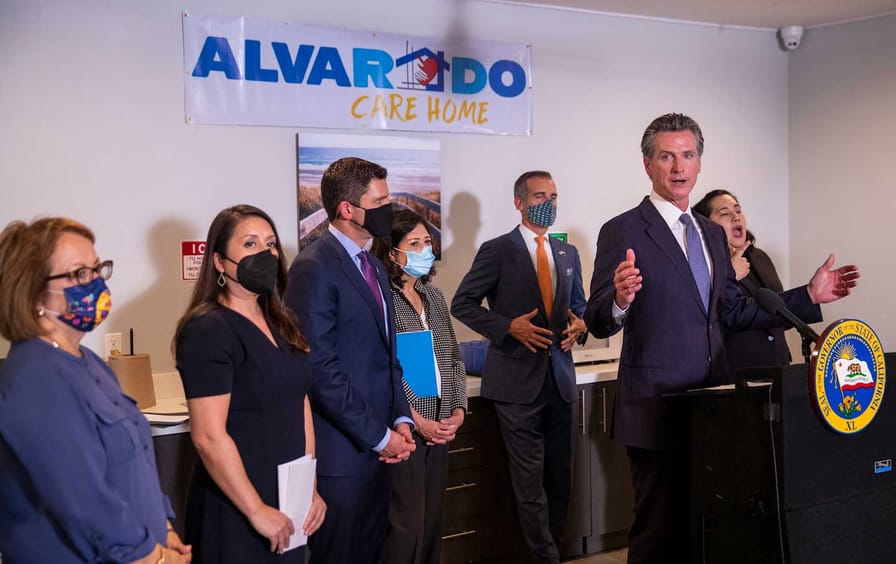 Gov. Gavin Newsom speaks before he signed legislation that supports the states work to expand mental health services and behavioral health housing