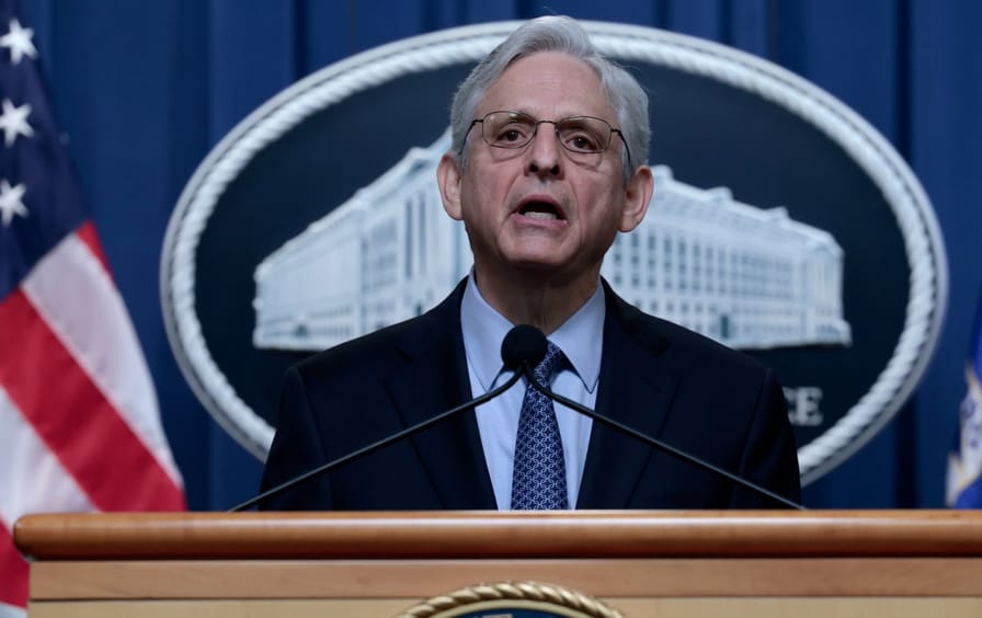 Merrick Garland, who tested positive for Covid, at a press conference