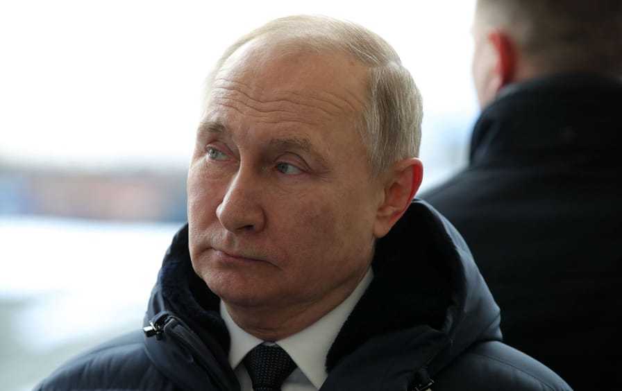 Vladirmir Putin looks away from the camara