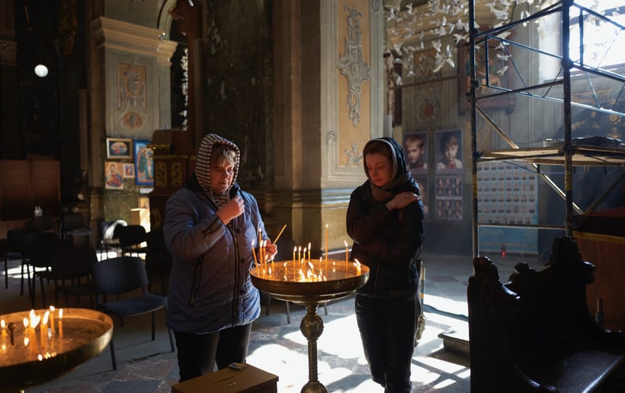 Anna and Alyona light candles