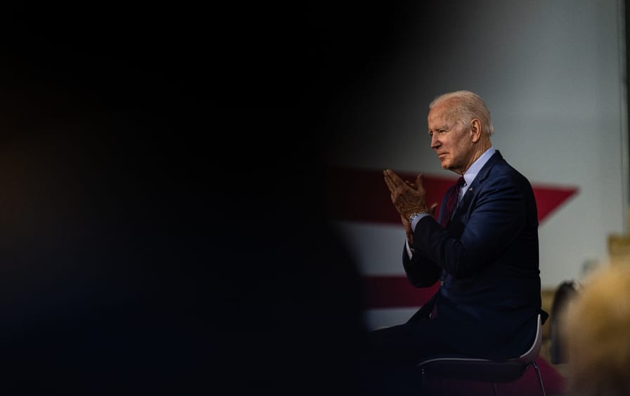 President Biden claps during a speech in Cincinnati