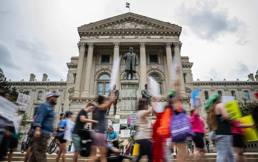 Pro-abortion protesters march outside Indiana state capitol building