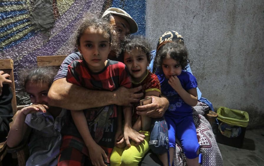 Palestinians huddle in “safe” areas during Israeli airstrikes
