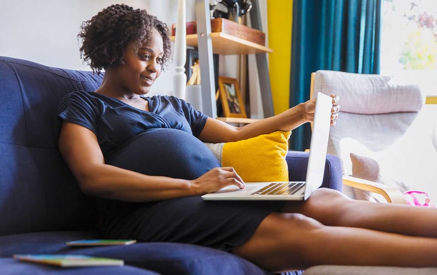 pregnant woman with a laptop