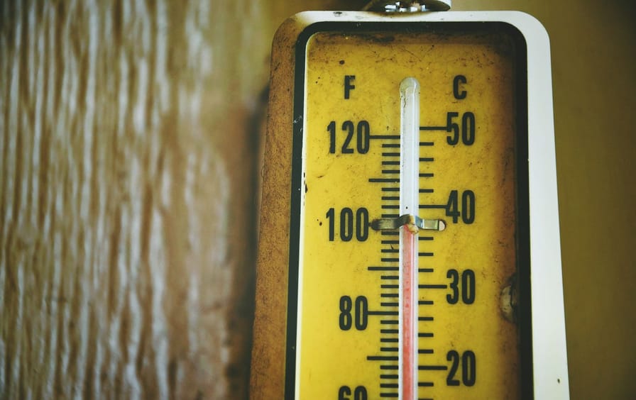 Close-Up Of Thermometer By Wood