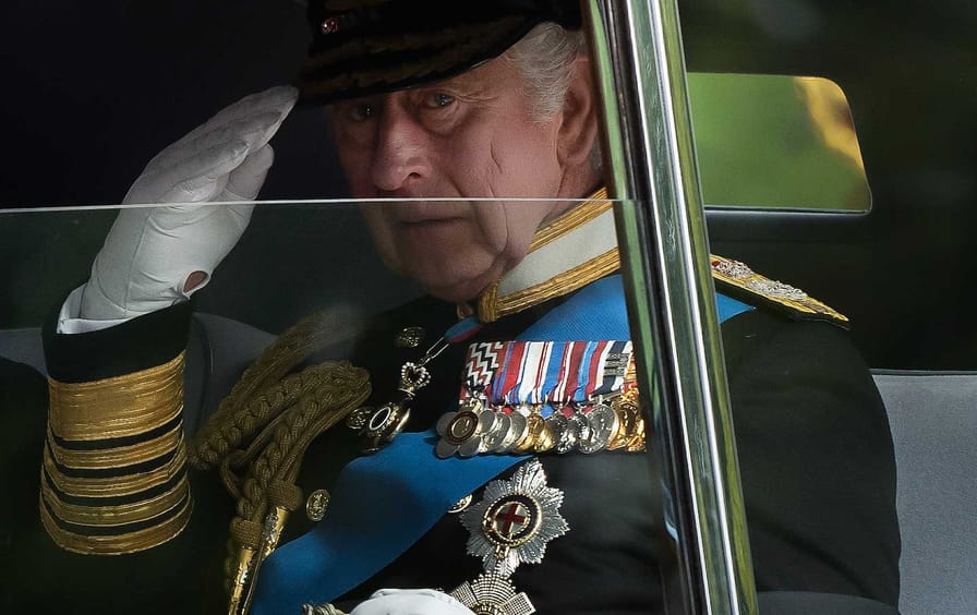 King Charles III drives past Wellington Arch