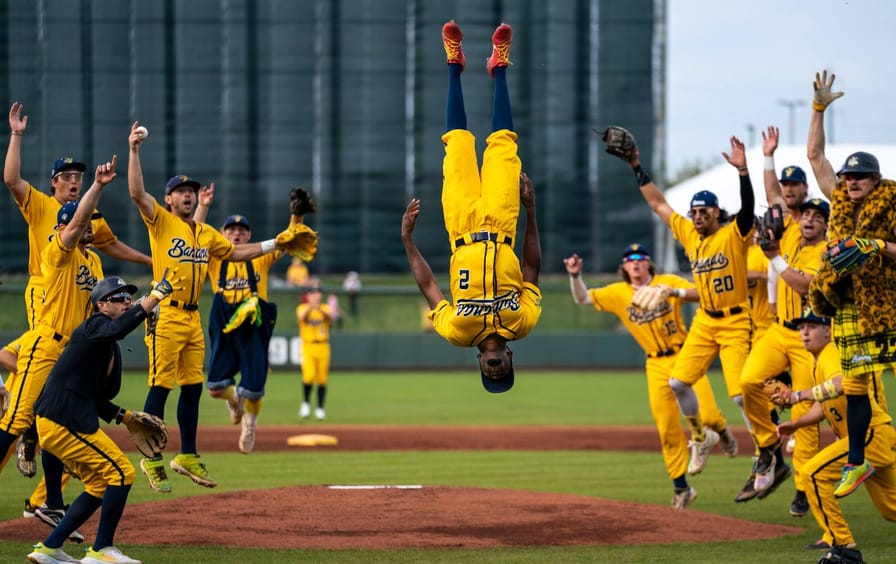 The Savannah Bananas cheer on the field before their Minor League Baseball game.