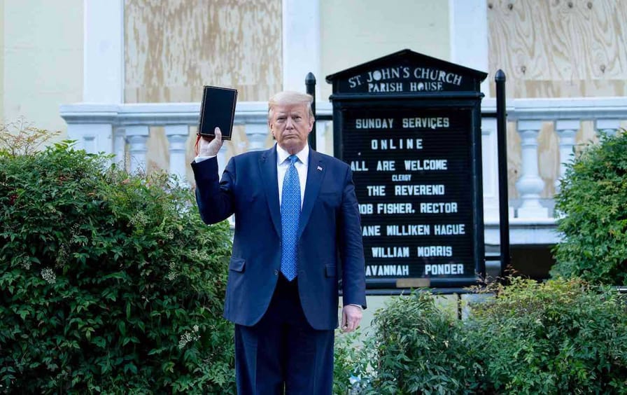 Donald Trump poses with a Bible