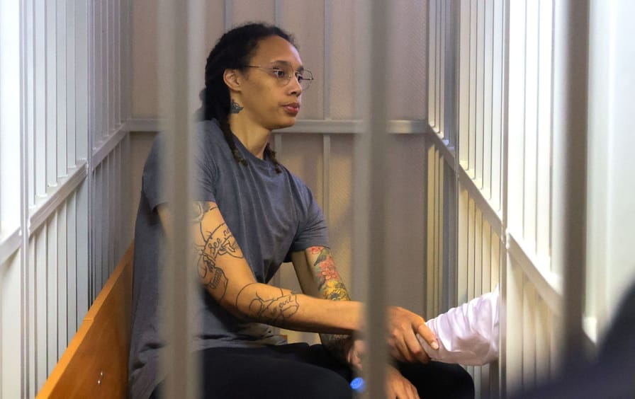 WNBA player Brittney Griner sits inside a defendants' cage after the Russian court's verdict during a hearing in Khimki outside Moscow, on August 4, 2022.