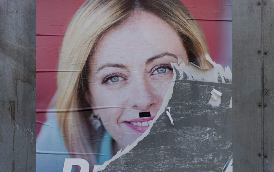A torn Fratelli d'Italia electoral poster a week before the Italian general election.