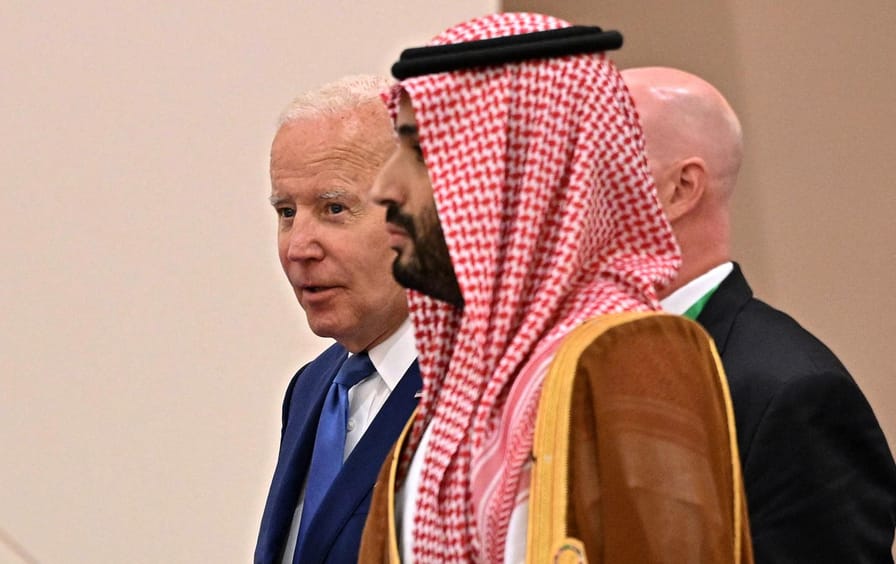 US President Joe Biden and Saudi Crown Prince Mohammed bin Salman walking together during the Jeddah Security and Development Summit (GCC+3) at a hotel in Saudi Arabia's Red Sea coastal city of Jeddah on July 16, 2022.