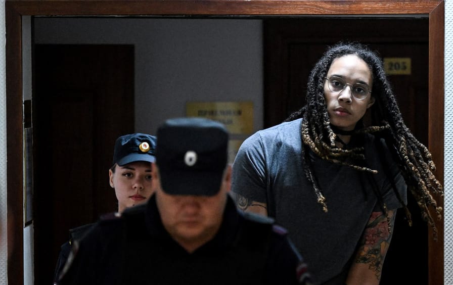 US WNBA player Brittney Griner is escorted to the courtroom to hear the court's final decision in Khimki outside Moscow