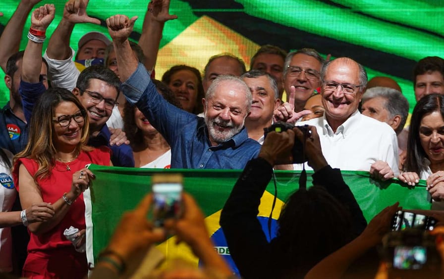Brazil's President-elect Luiz Inácio Lula da Silva of the Workers' Party raises his fist as he delivers his first speech after his victory over then-President Jair Bolsonaro of the Liberal Party.