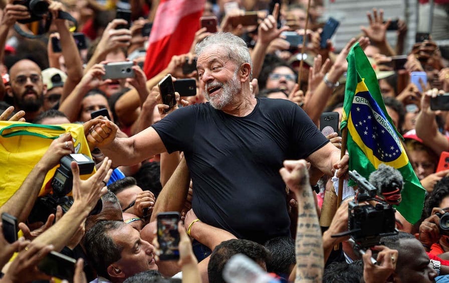 Luiz Inacio Lula da Silva greets supporters