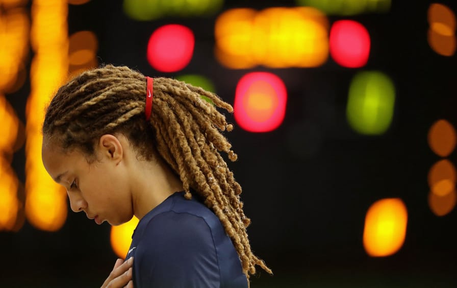 United States women's basketball star Brittney Griner looks down during the national anthem before a game against Canada at the Rio 2016 Olympic Games.