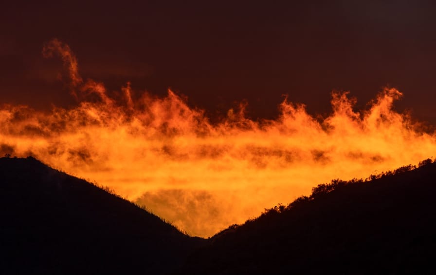 A storm in the Angeles National Forest looks like clouds on fire.