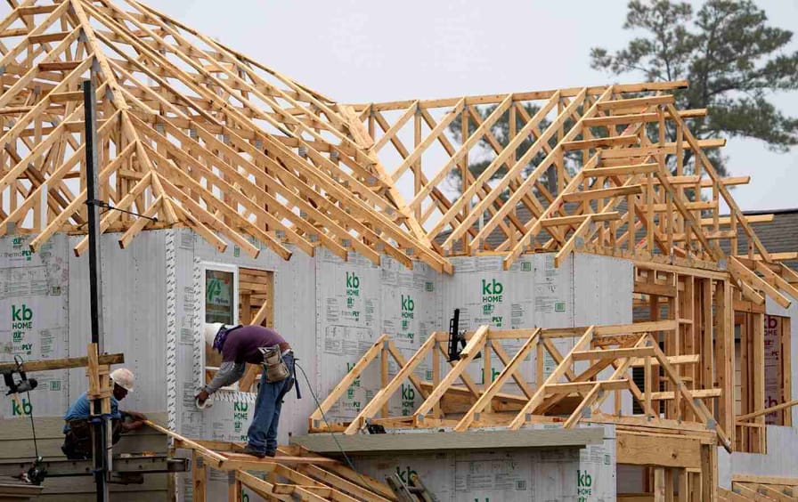 Construction workers build a new home.