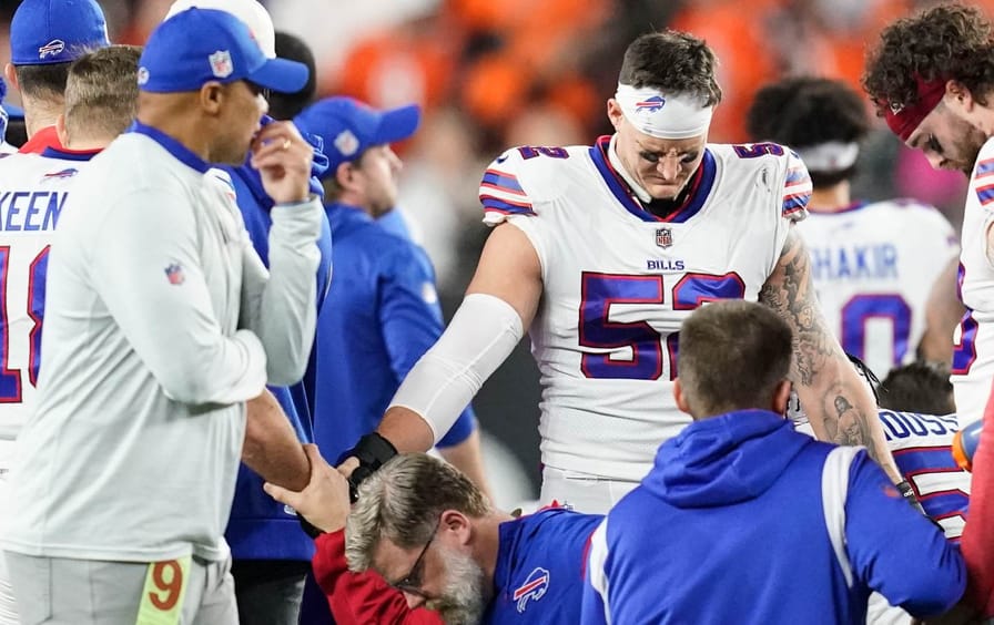 Buffalo Bills players and staff pray for teammate Dummer Hamlin during the first half of the NFL football game against the Cincinnati Bengals on Monday, Jan. 2, 2023 in Cincinnati.