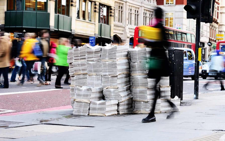 Newspapers piled up on London street