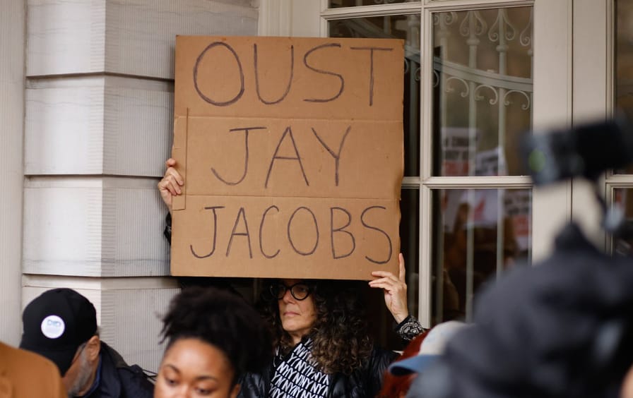Members of the Democratic Party gather to protest against Jay Jacobs, chairman of the New York State Democratic Committee, outside of City Hall in New York