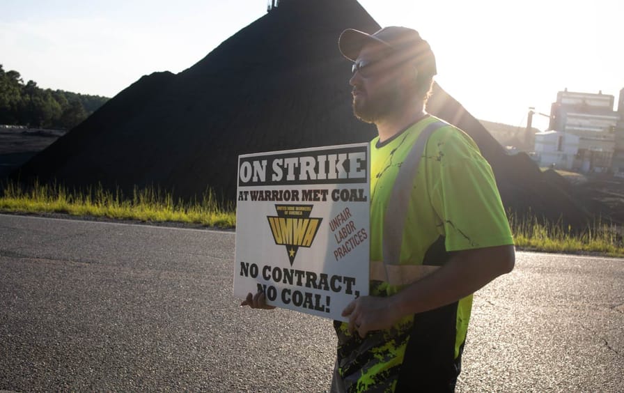 Striking coal miners, who have been on strike for 18 months, form a picket line outside of the Warrior Met Coal Mine no. 5 on September 1, 2022 in Brookwood Alabama.