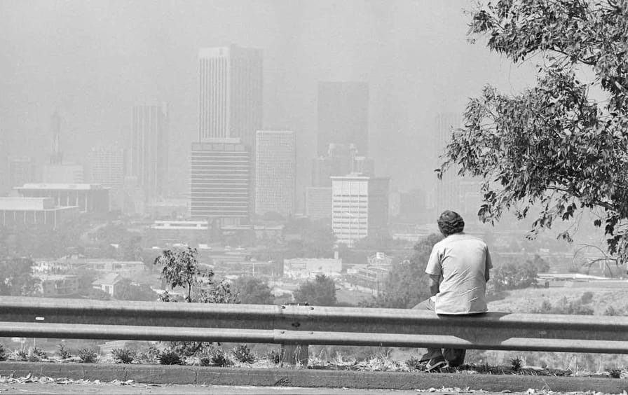 Man Seated,Looking @ Smoggy Los Angeles