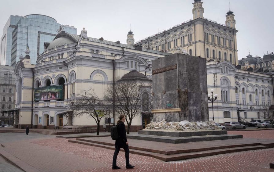 Man walks by the Ukranian National Opera building in Kyiv