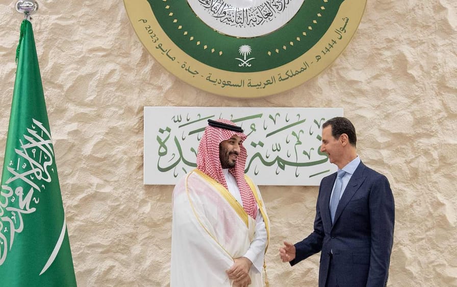 Saudi Arabian Crown Prince Mohammed bin Salman greets the head of Syrian regime Bashar Al Assad, ahead of the 32nd Arab League Summit in Jeddah, Saudi Arabia on May 19, 2023.