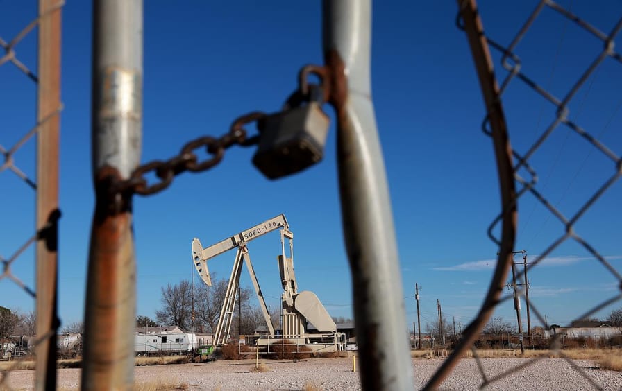 An oil pumpjack works in the Permian Basin oil field