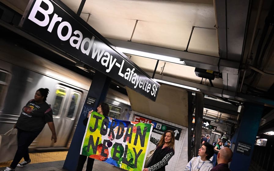 Protesters at the Broadway/Lafayette Street subway station during a 