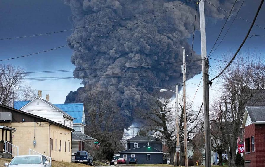 A thick black plume rising over East Palestine, Ohio on February 6 after some 50 cars on a Norfolk Southern train derailed.