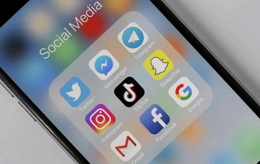 In this photo illustration, the social medias applications logos, Twitter, Messenger, Telegram, Instagram, Tik Tok, Snapchat, Gmail, Facebook and Google are displayed on the screen of an Apple iPhone.