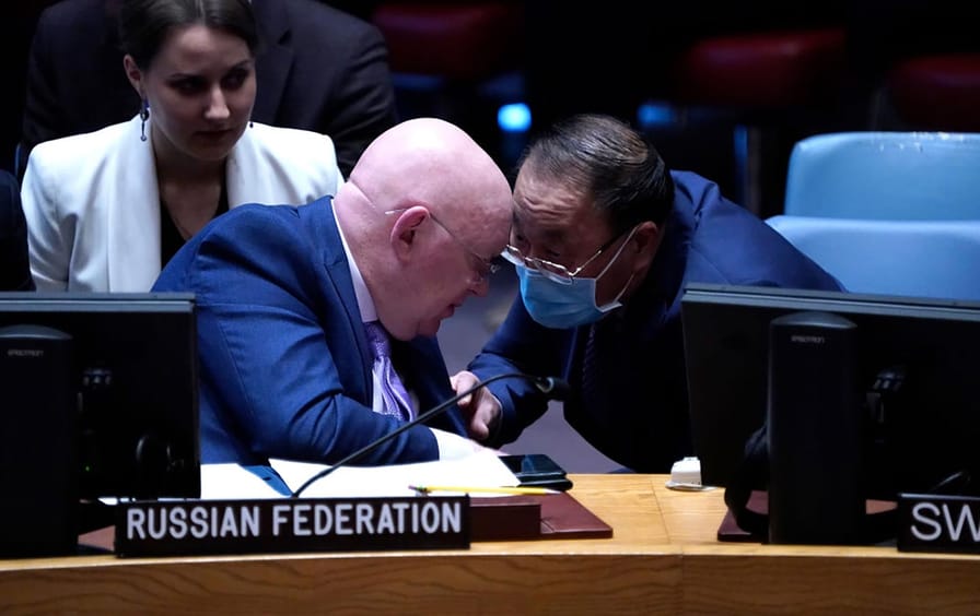Ambassador Vassily Nebenzia, permanent representative of Russian Federation to the United Nations, and Ambassador Zhang Jun, permanent representative of China to the UN, engage in conversation during the UN Security Council meeting on Nord Stream pipeline explosions at the UN Headquarters on February 21, 2023, in New York City.
