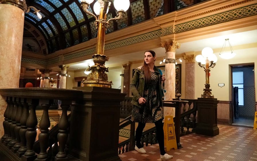 State Representative Zooey Zephyr walks into the state capitol on her first day of remote voting