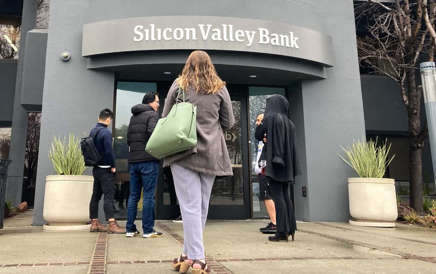 People stand outside Silicon Valley Bank.