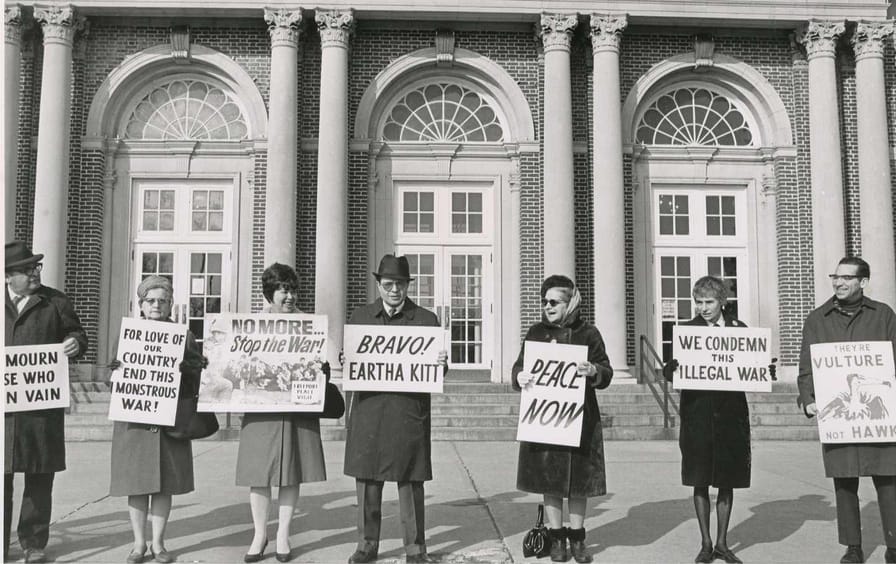 Members of the Freeport Peace Vigil stand as they have stood for over 40 Sundays on the steps of the post office in Freeport, New York, carrying signs protesting the war in Vietnam on Jan. 21, 1968.