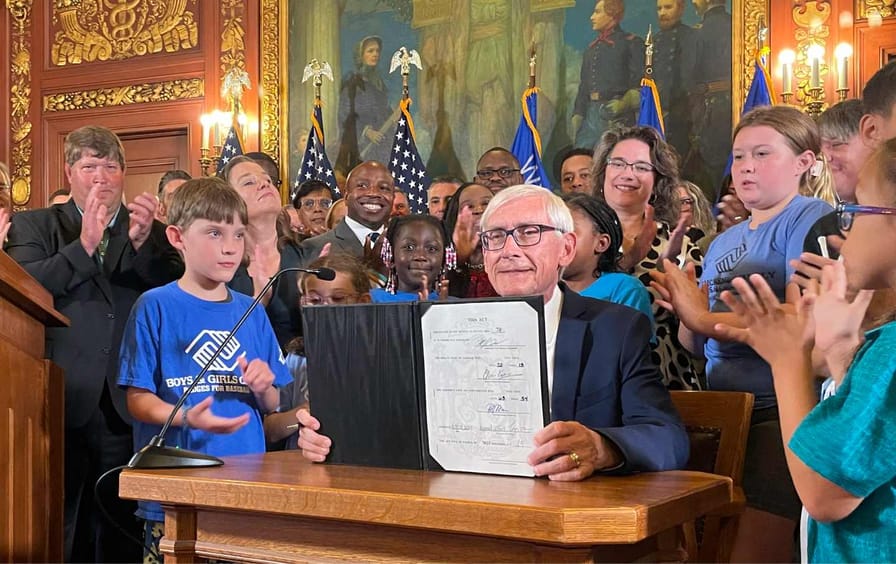 Wisconsin Gov. Tony Evers displays a two-year budget that he signed, Wednesday, July 5, 2023, in Madison, Wis.