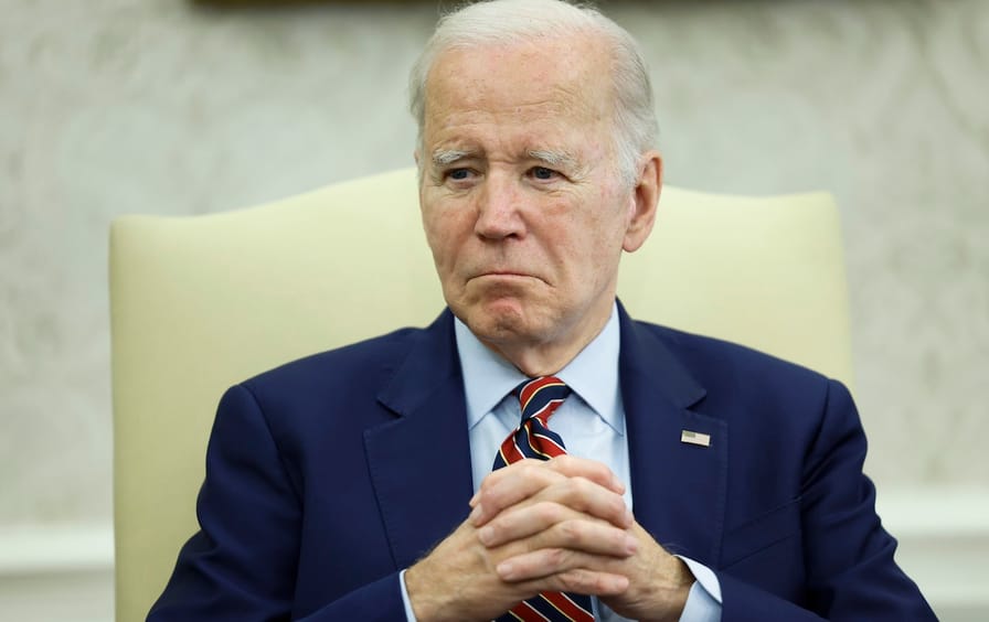 US President Joe Biden listens as Spanish Prime Minister Pedro Sánchez gives remarks to reporters before a bilateral meeting in the Oval Office on May 12, 2023.