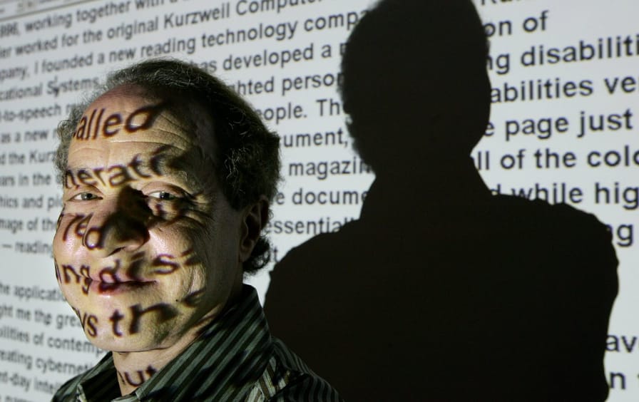 Ray Kurzweil with words projected over his face
