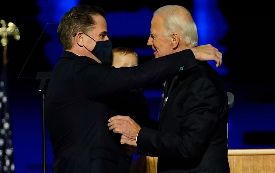 president joe biden and son hunter biden hug after a speech