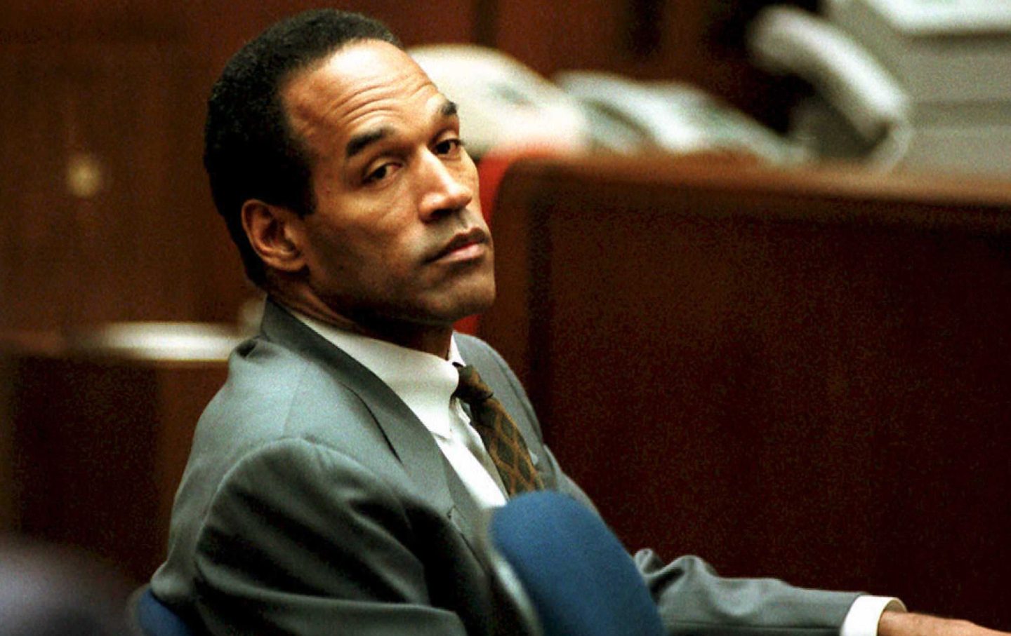 LOS ANGELES, CA - DECEMBER 8: O. J. Simpson sits in Superior Court in Los Angeles 08 December 1994 during an open court session where Judge Lance Ito denied a media attorney's request to open court transcripts from a 07 December private meeting involving prospective jurors. Final selection of alternate jurors by attorneys in the double murder case is expected later this afternoon. (Photo credit should read POOL/AFP via Getty Images)