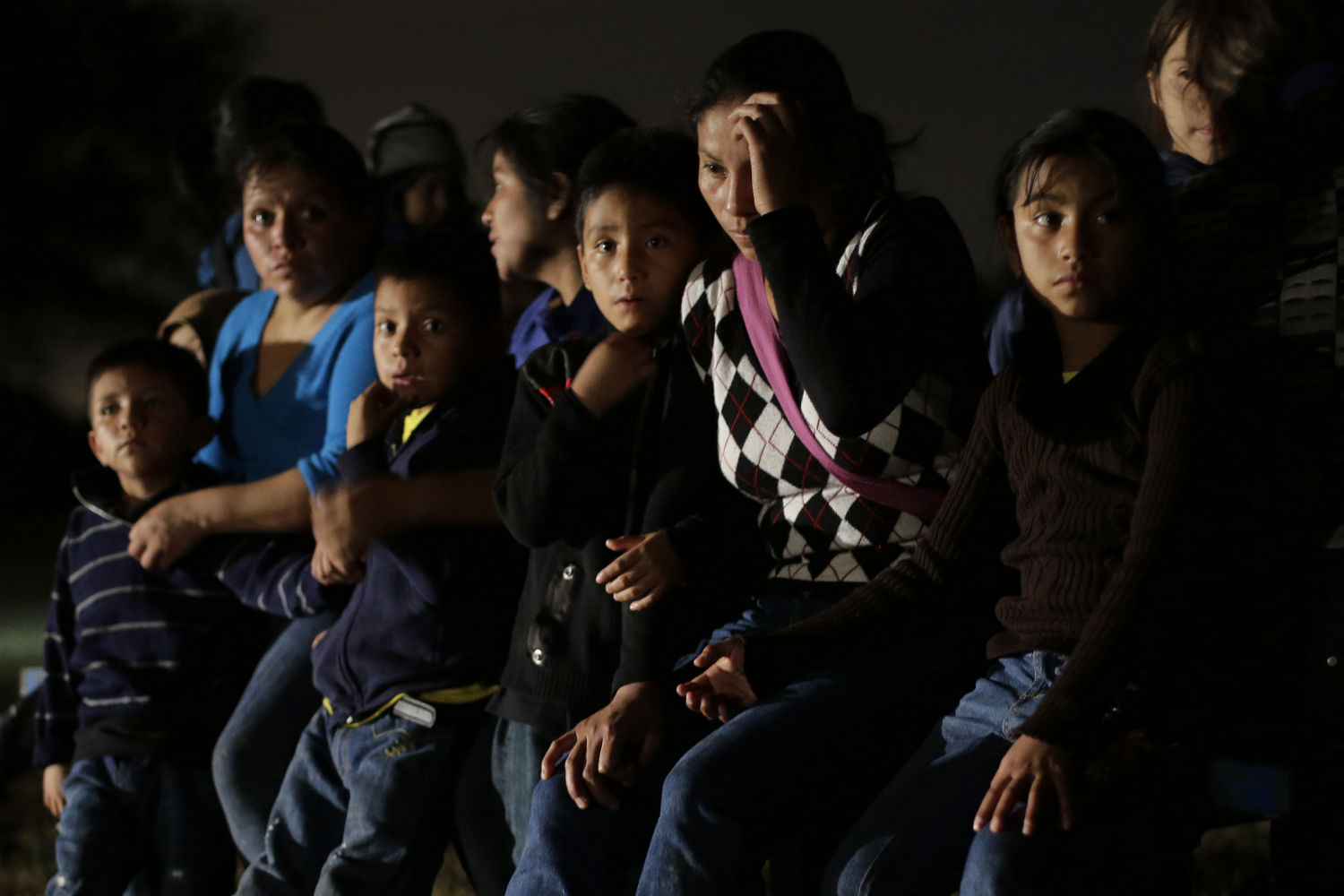 Children with their mothers waiting for the unknown. 