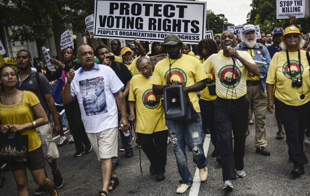 Marchers-carry-signs-urging-action-on-jobs-voting-rights-and-gun-violence-during-the-50th-anniversary-commemoration-of-the-March-on-Washington.-ReutersJames-Lawler-Duggan