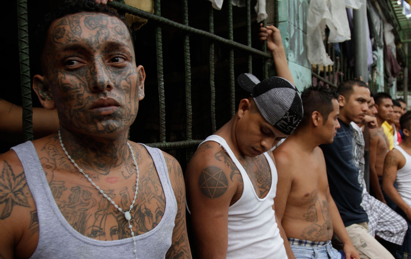 Members of the M-18 gang stand inside the prison in Quezaltepeque, El Salva...