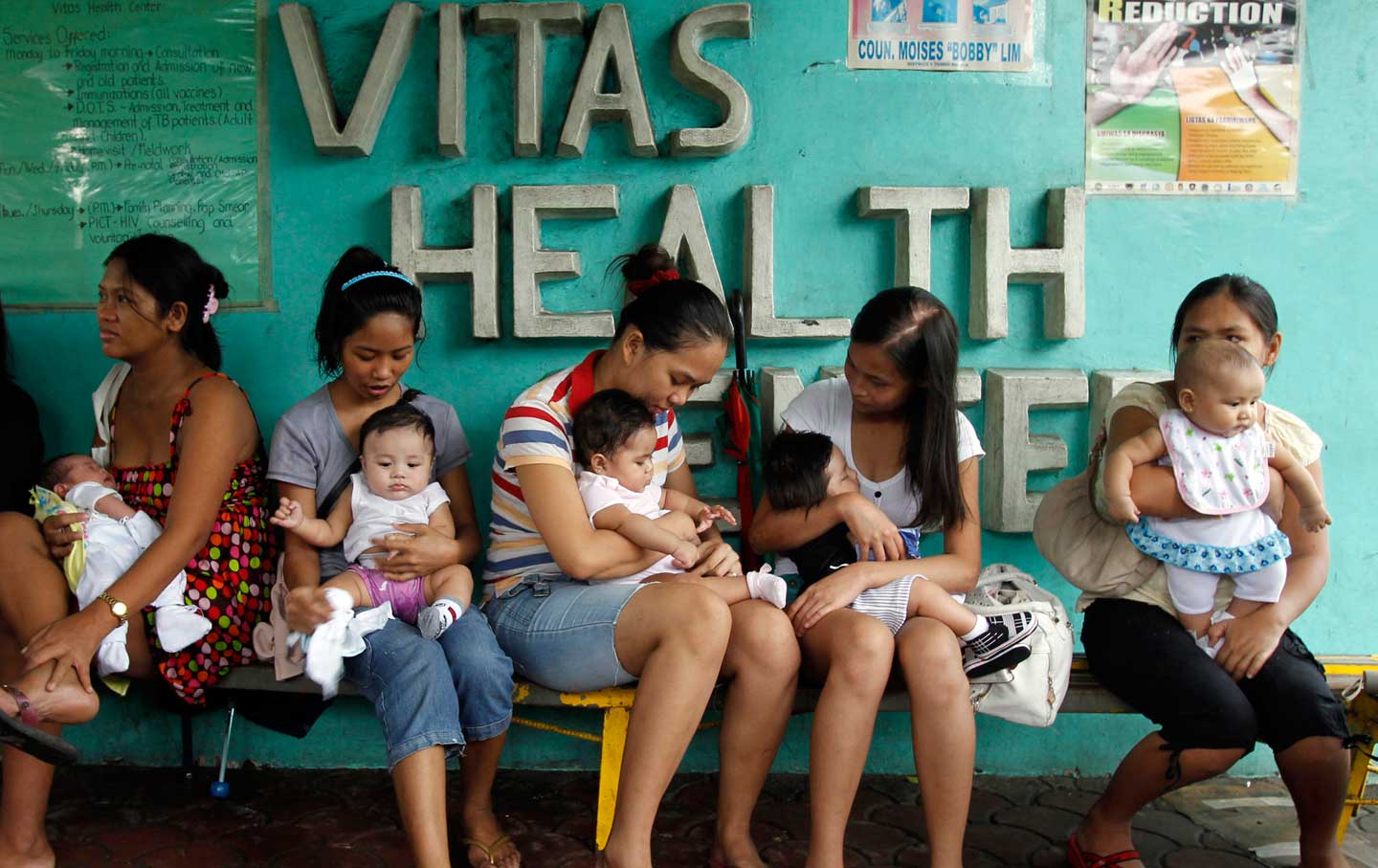 Young mothers at a health clinic in Manila. In 2012, the Catholic Church opposed a bill guaranteeing access to birth control and sex education in the Philippines. Credit: Erik de Castro / Reuters