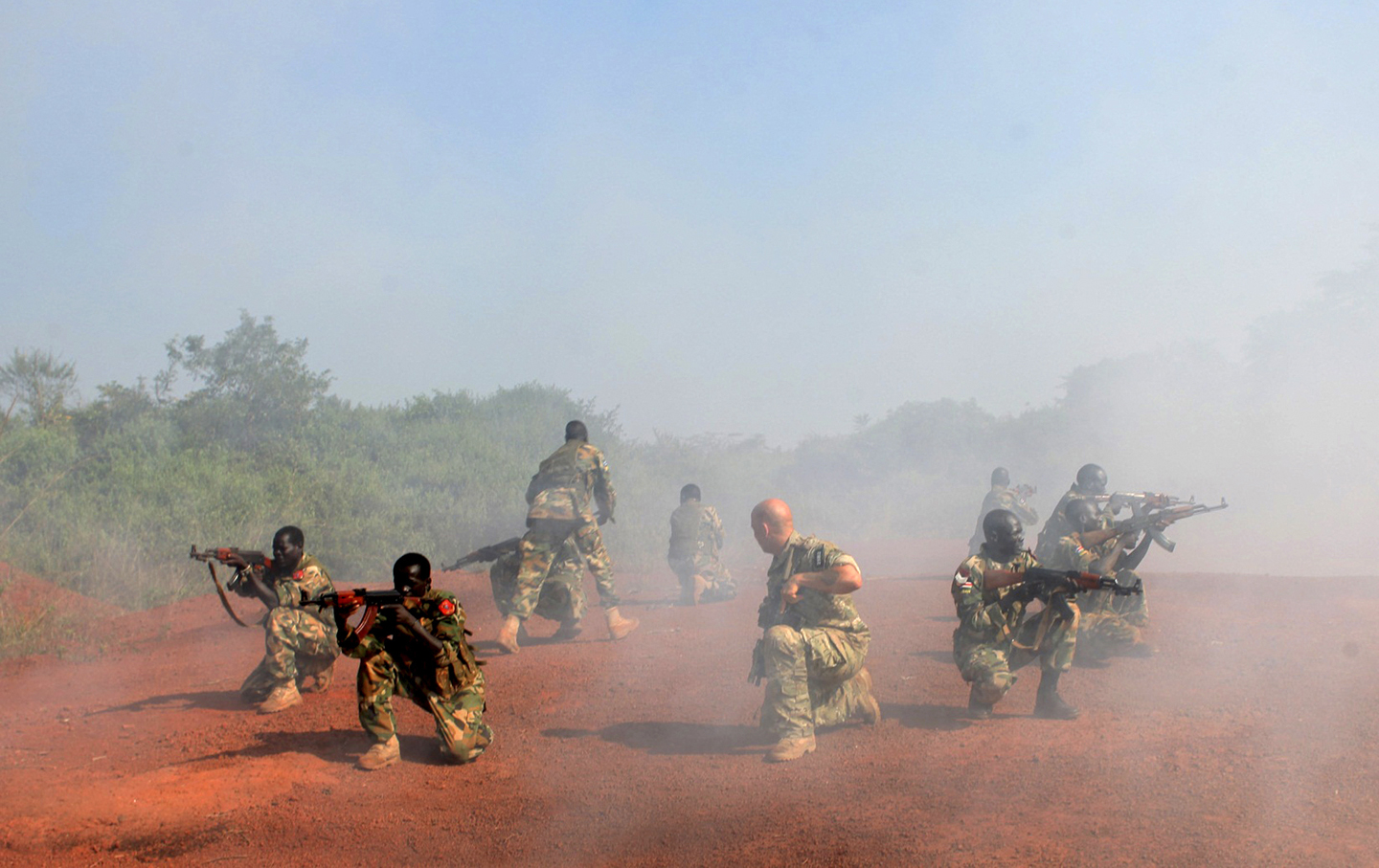 A U.S. Special Forces trainer supervises a military assault drill for a unit within the Sudan People's Liberation Army conducted in Nzara on the outskirts of Yambio